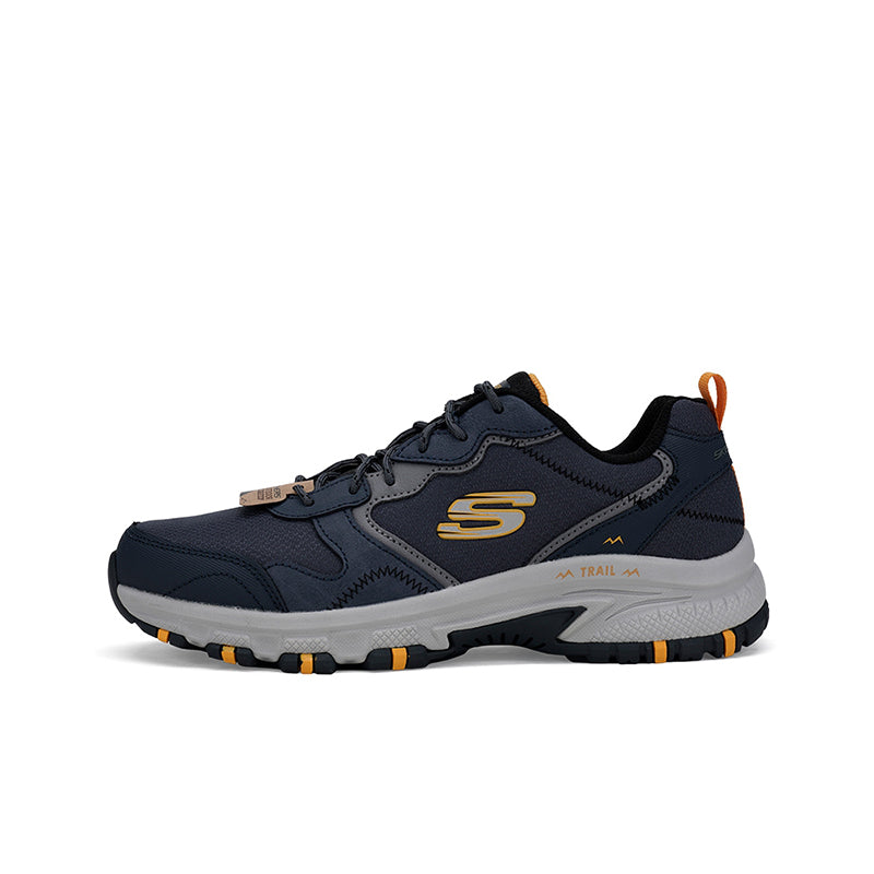 Men's casual sneaker, navy with gray accents, gold S logo and orange tread details