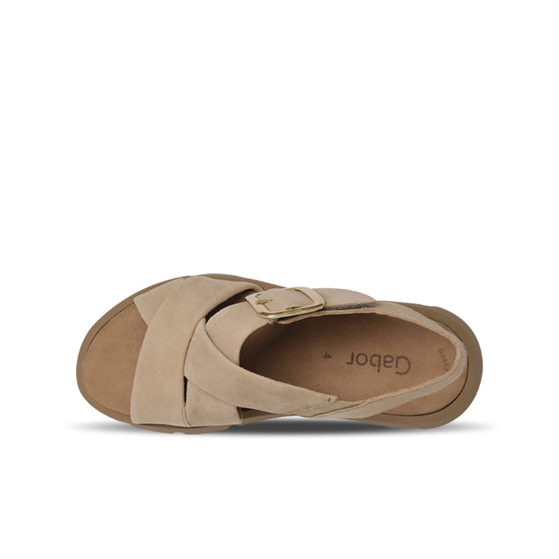 Tan leather slide sandals with square metal buckle and cushioned footbed