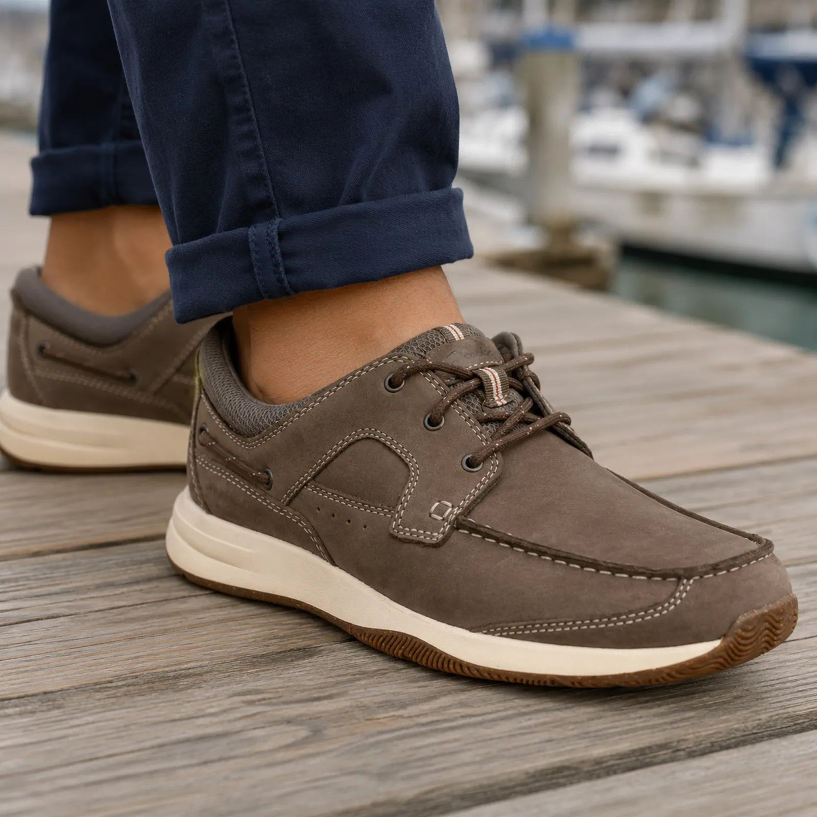 Brown nubuck lace-up sneakers with stitched moc-style panel and textured sole