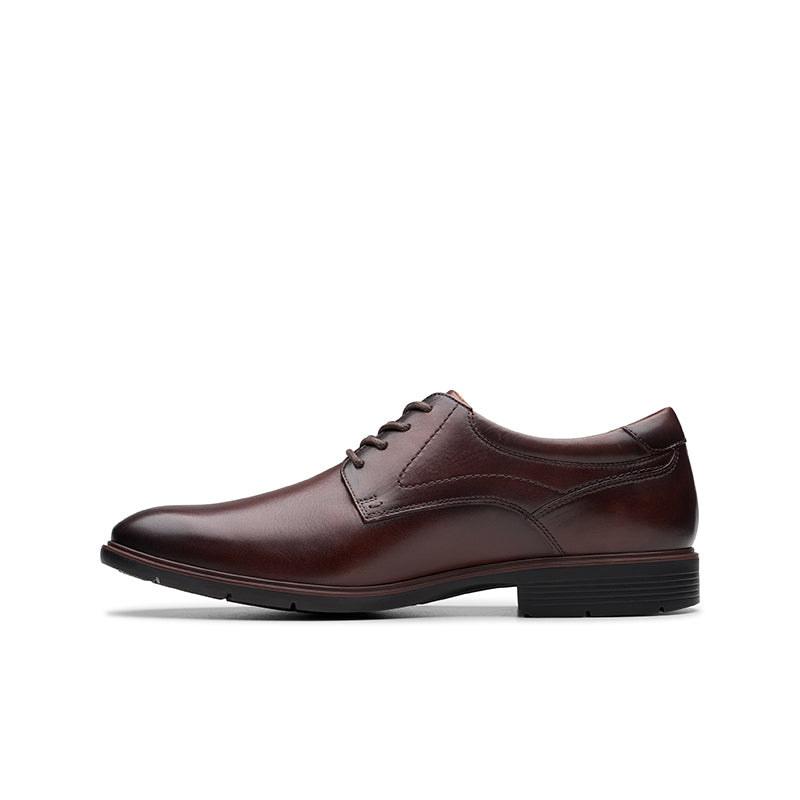 Men's oxblood leather lace-up dress shoe with smooth rounded toe and low sole