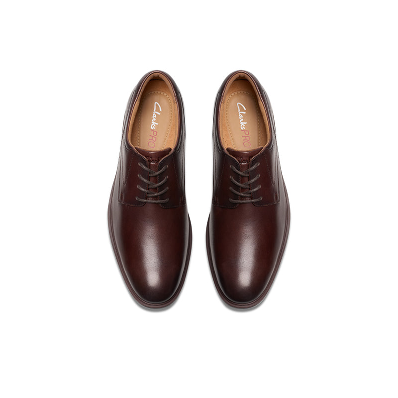 Pair of men's oxblood leather lace-up dress shoes with tan lining