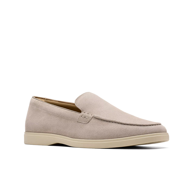 Suede slip-on loafers with moc seam detail, light grey upper and beige outsole.