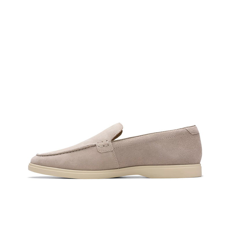Suede slip-on loafers with moc seam detail, light beige upper and beige outsole.