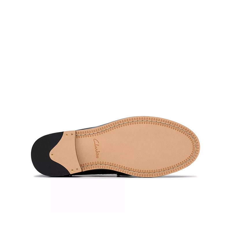 Leather loafer outsole with tan tread and dark heel