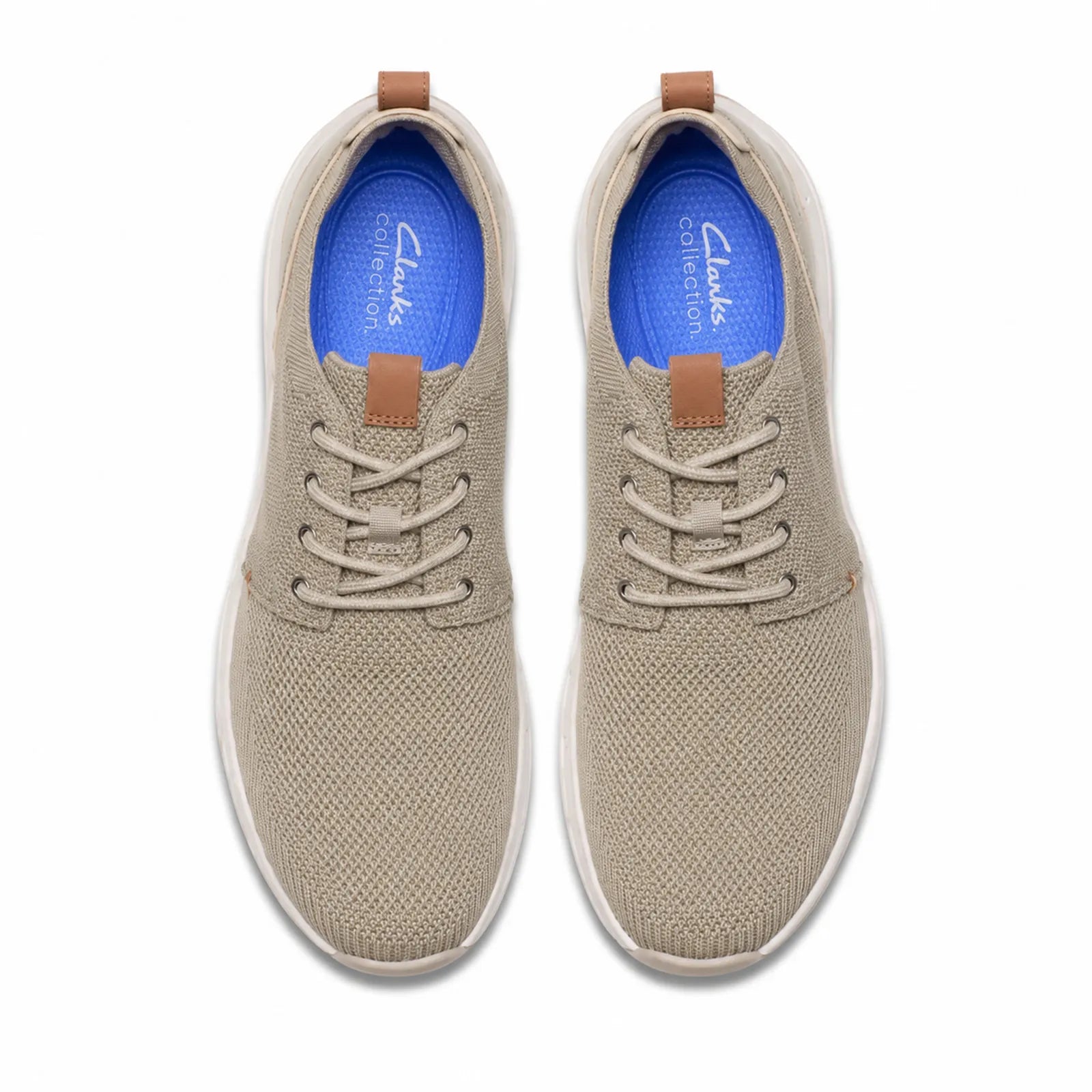 Pair of men's beige lace-up sneakers with tan pull tabs and white rubber sole