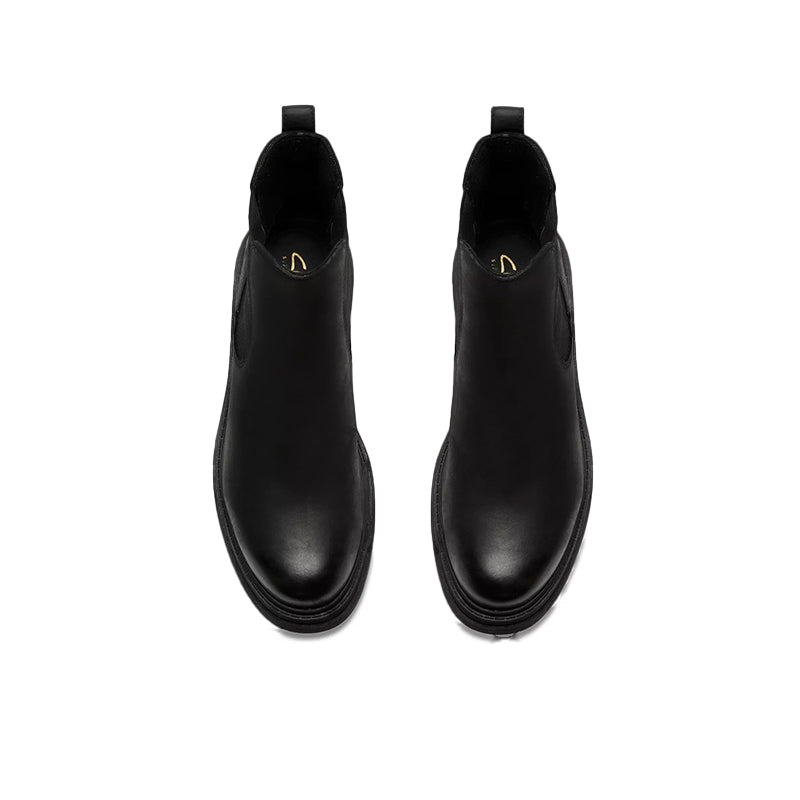 Pair of black leather ankle boots with elastic sides and rear pull tabs