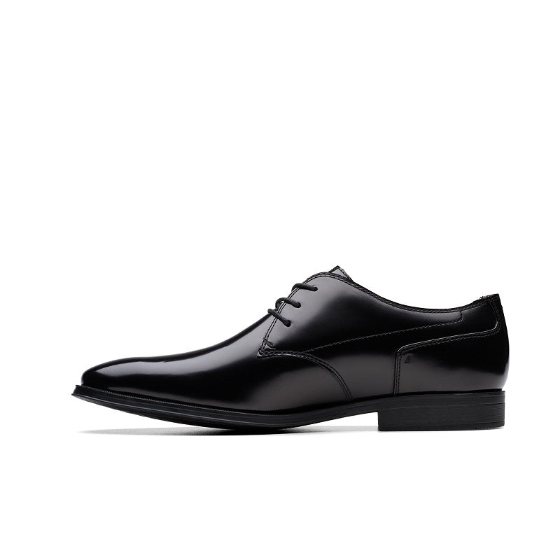 Black leather lace-up dress shoe with cap toe and polished finish