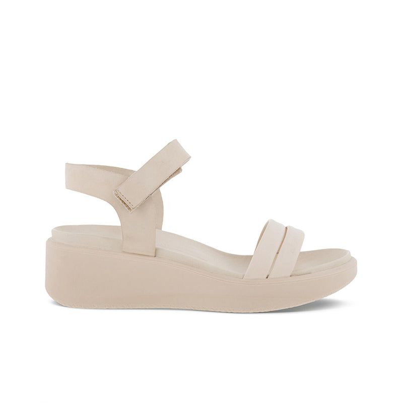 Beige wedge sandals with ankle strap and wide cushioned platform