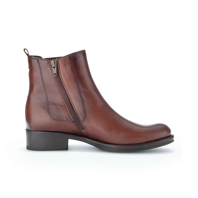 Brown ankle boots with side zipper, elastic gore panels, and low block heel