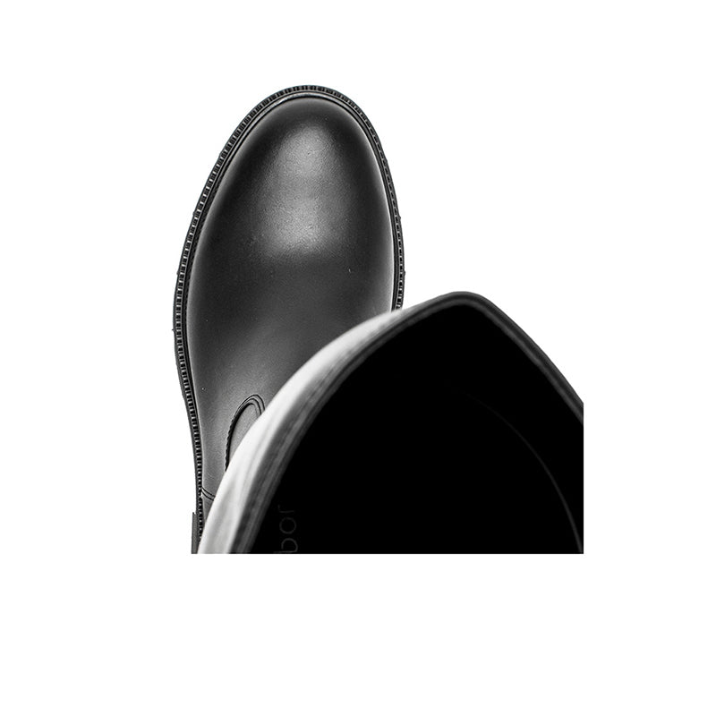 Black leather tall boot toe and interior opening close-up