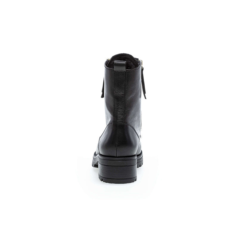 Women’s black leather ankle boots, rear view with pull tab and stacked heel
