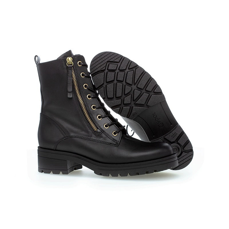 Women’s black ankle boots with lace-up front and treaded rubber outsole