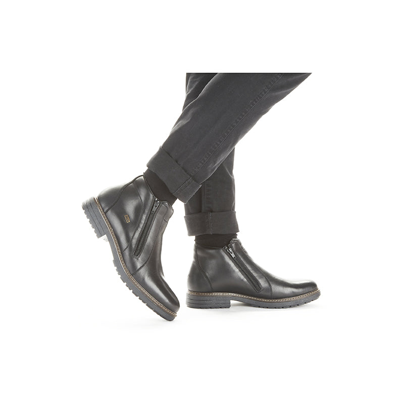 Men's black leather zip boots, side view with treaded outsole