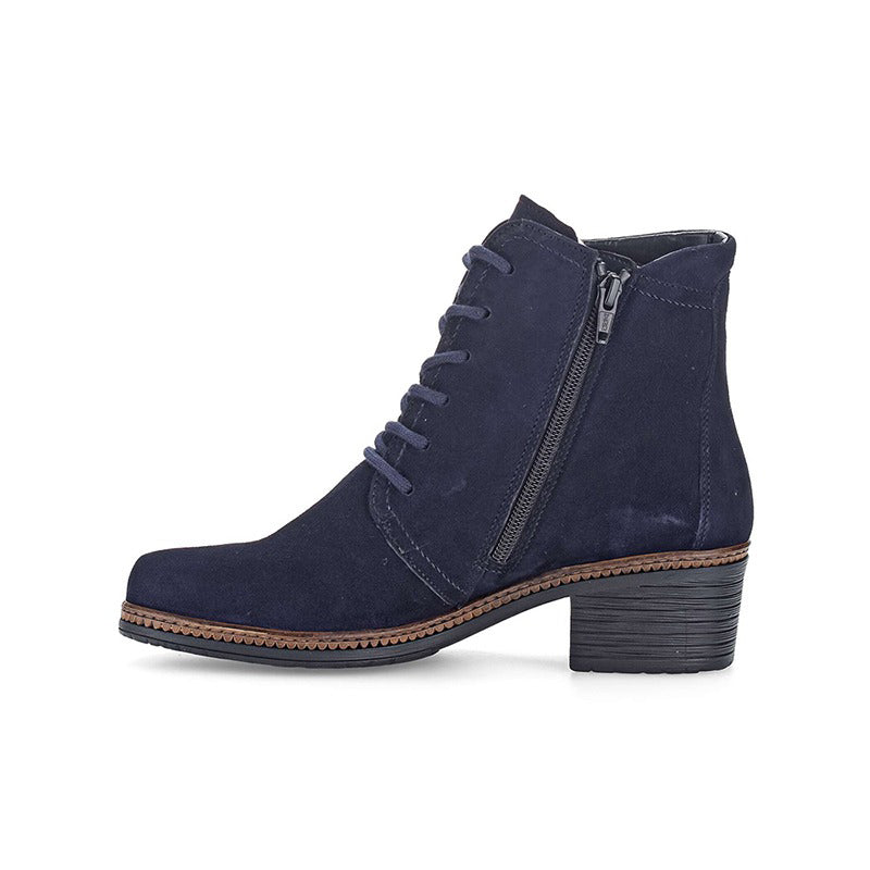 Navy suede ankle boot with side zip, lace-up front, and mid block heel