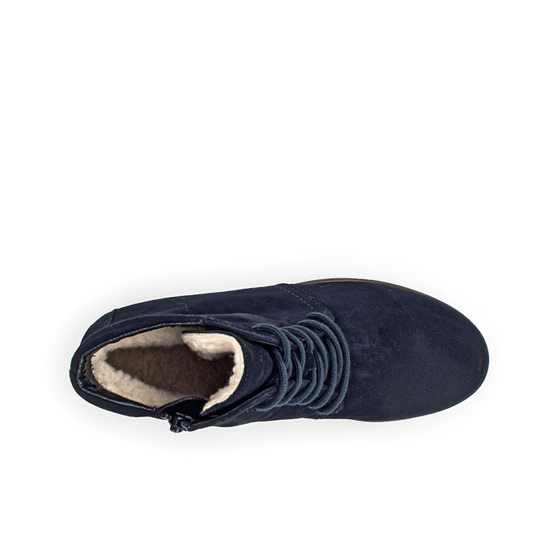 Navy suede ankle boot with lace-up front and fleece-lined collar