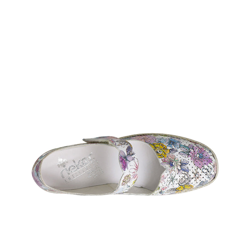 Women's slip-on sandal interior view with floral upper and cushioned footbed
