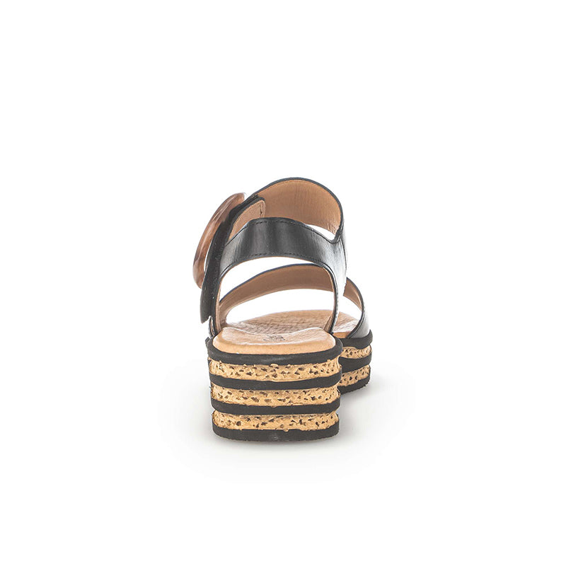 Black leather platform sandals with two straps and buckled ankle strap