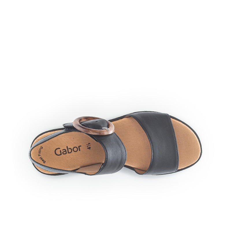 Black leather slide sandals with wide two-strap upper and open toe platform