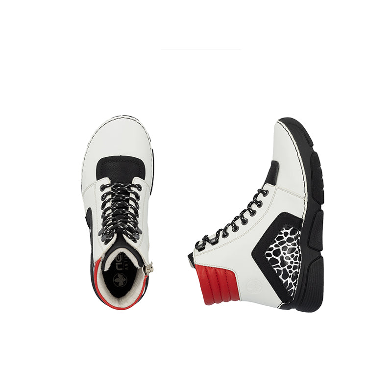 Women's ankle boots showing toe and side profiles, white upper with black trim