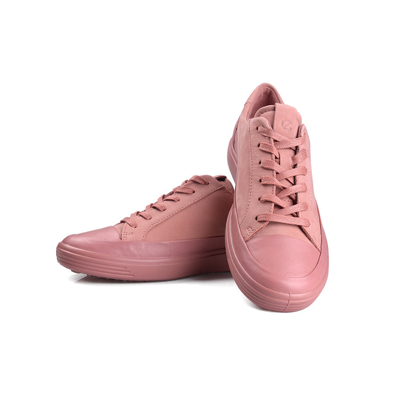 Pair of pink leather lace-up sneakers with laces and treaded rubber soles