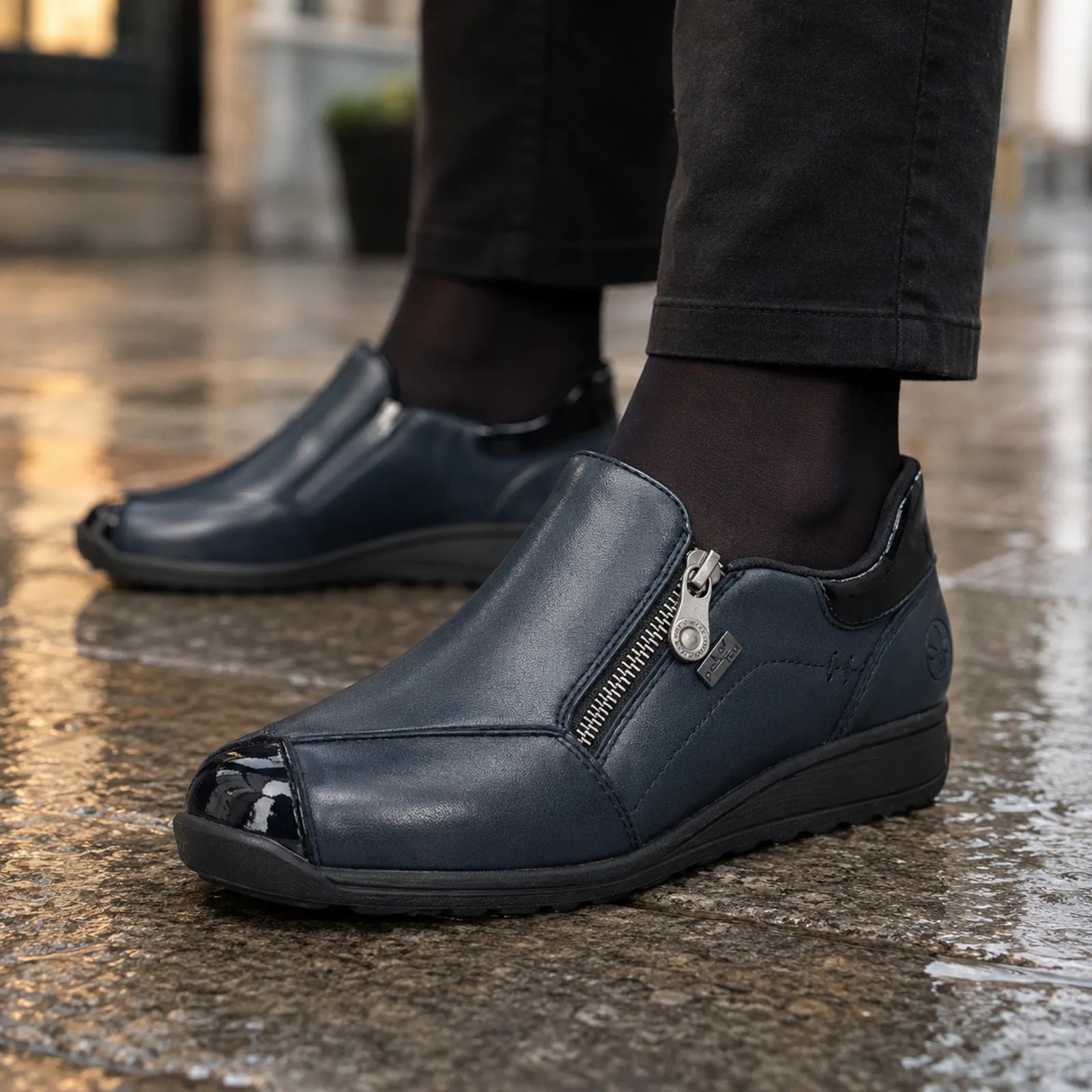 Rieker 47267 women's Navy comfort shoes worn with black trousers
