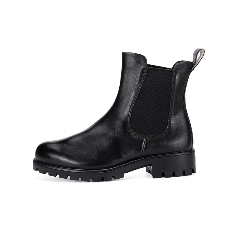 Black leather Chelsea boot with elastic side panels, pull tab, and lug sole