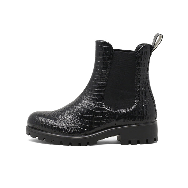 Black leather Chelsea boot side view with elastic gore and pull tab