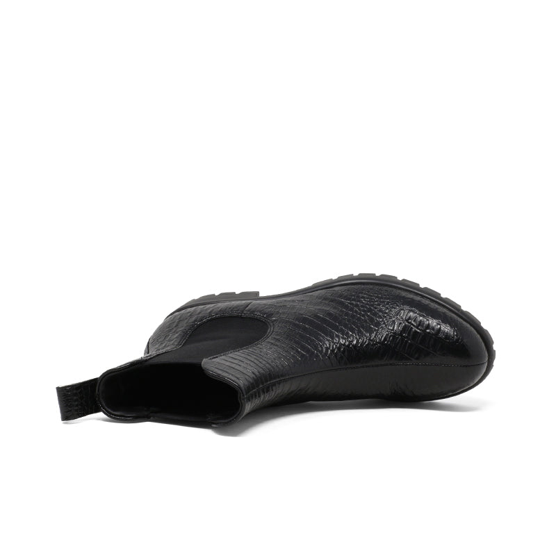 Black leather Chelsea boot profile with elastic side and rounded toe