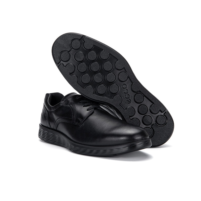 Black leather lace-up derby shoes with treaded outsole, heel and toe visible