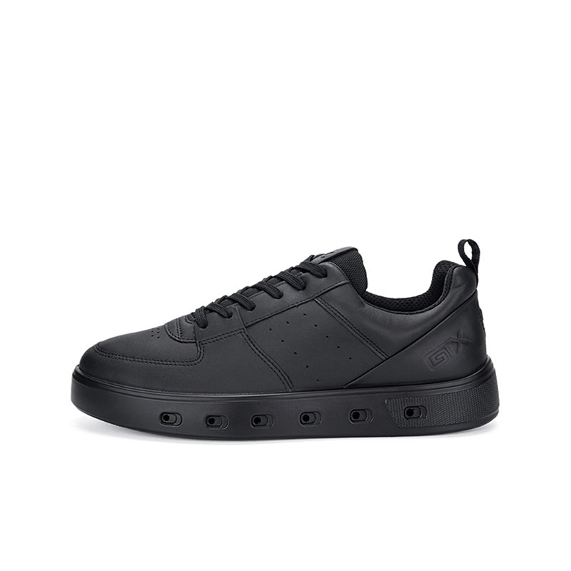 Black mens sneakers with lace-up closure, perforated toe, and cushioned collar.