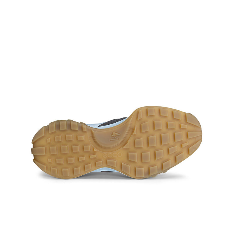 Sneaker outsole view with tan rubber tread and textured grip pattern