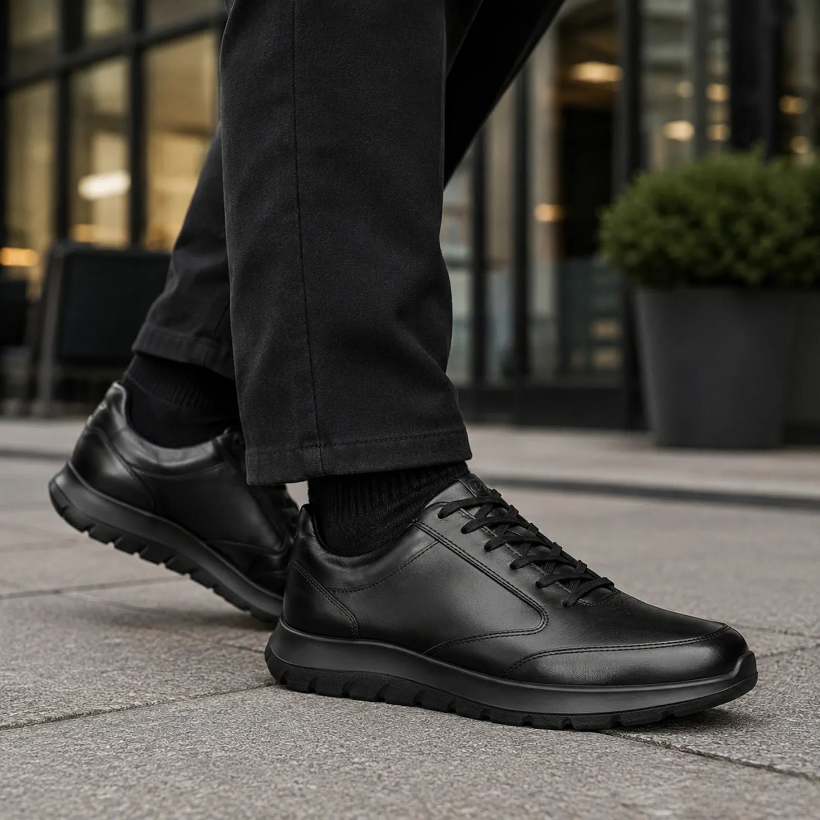 ECCO City Stride men's brown leather trainers worn with smart casual outfit for everyday wear