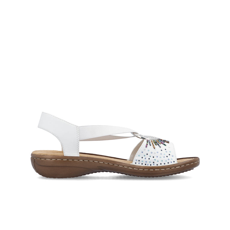 Women’s white slip-on sandals with perforated toe straps and beaded decoration
