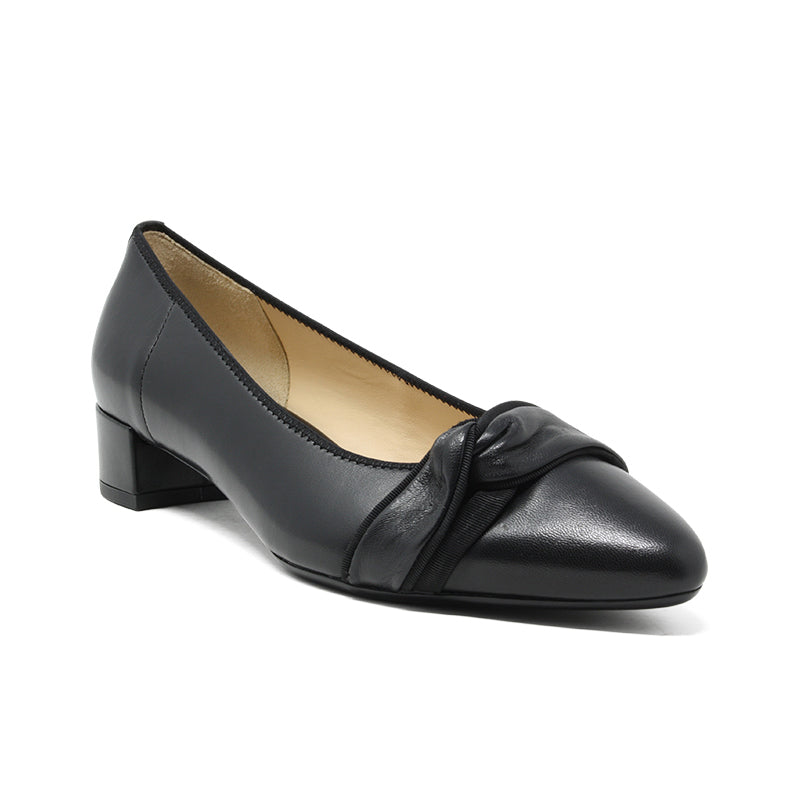 Women's black leather slip-on pumps with twisted bow detail and low block heel