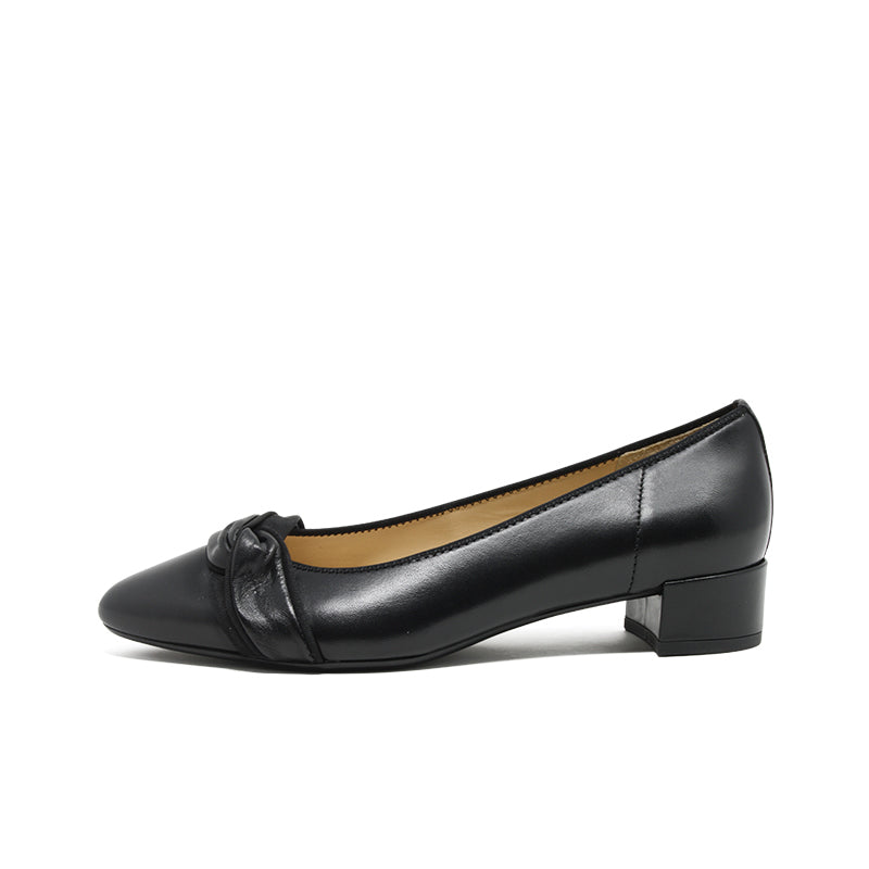 Women's black leather slip-on pumps with bow at vamp and low block heel