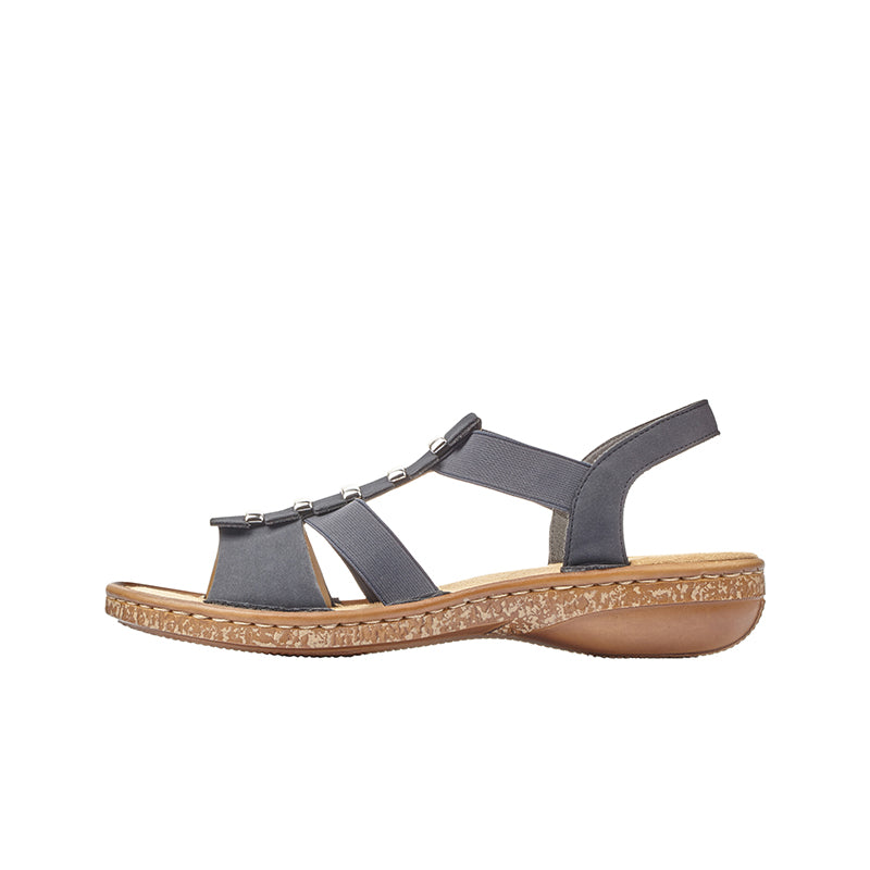 Navy blue flat sandals with two wide cross straps and metal buckle detail
