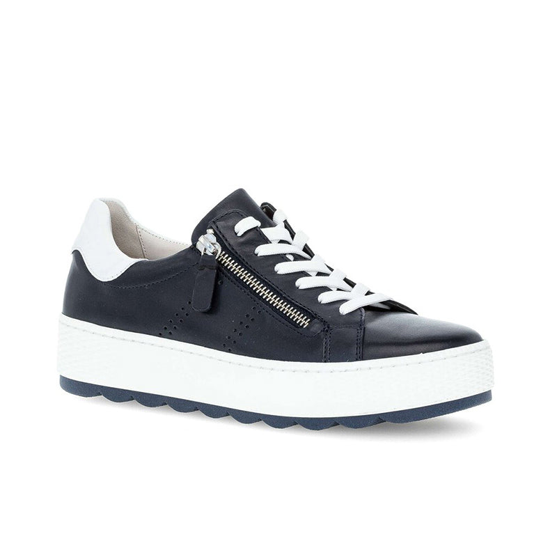 Midnight leather low-top sneaker with white laces, side zip, and chunky sole