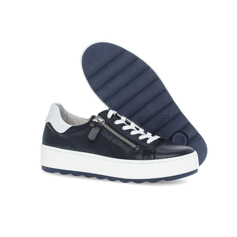 Midnight leather sneaker with white laces, side zip, and cushioned collar