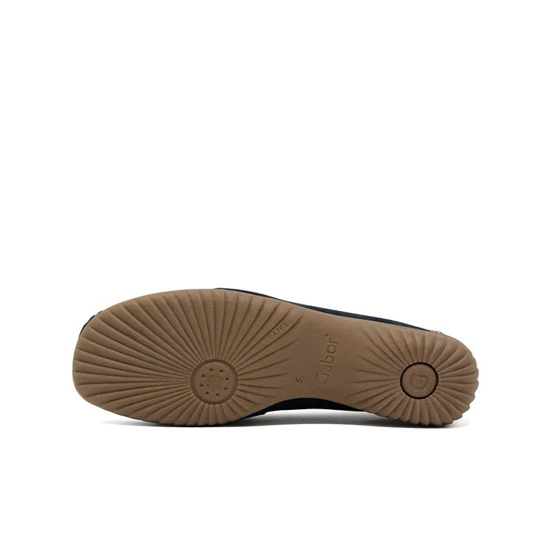 Loafer shoe outsole with circular tread pattern and brand mark