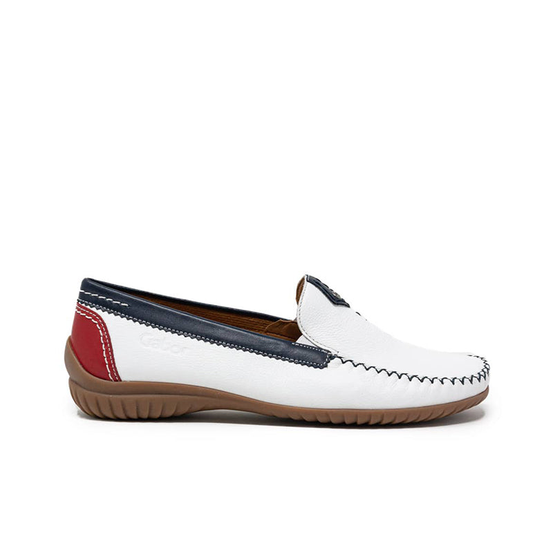 White leather slip-on loafer with navy strap and red side panel; brown sole