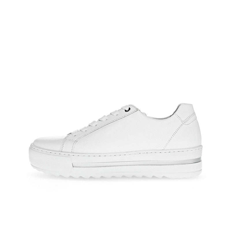White leather low-top trainers, side view with lace-up and thick sole