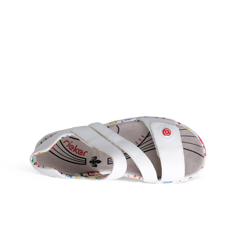 White sandals with dual hook-and-loop straps and cushioned patterned footbed