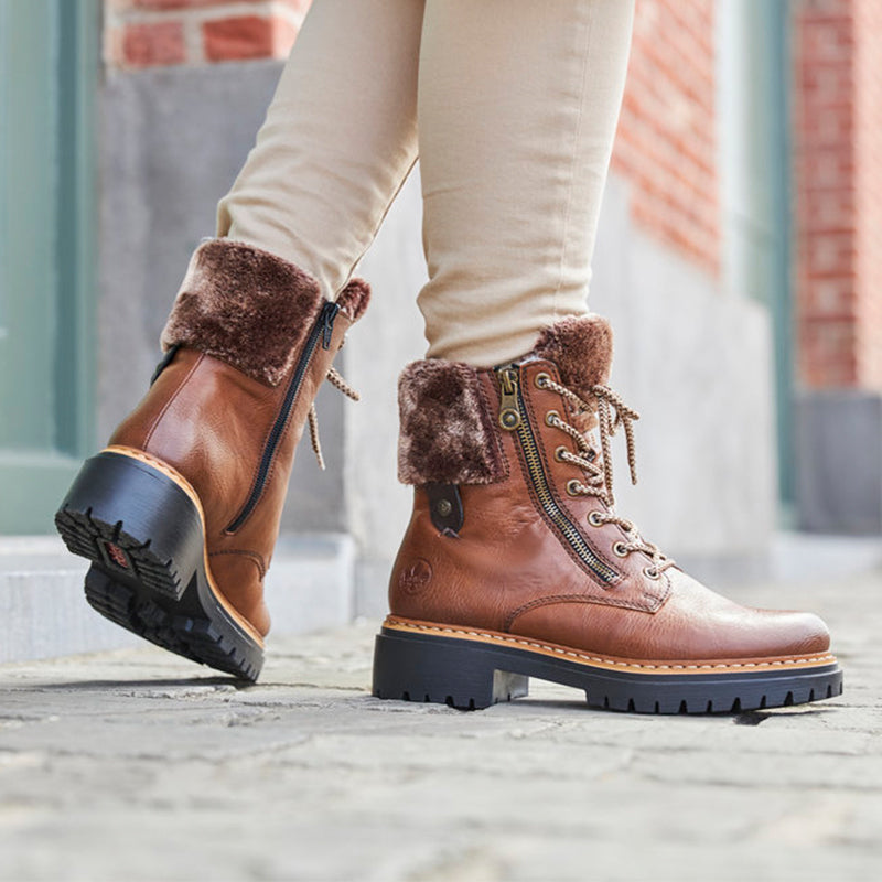 Brown lace-up winter boots with side zip and faux-fur cuffs