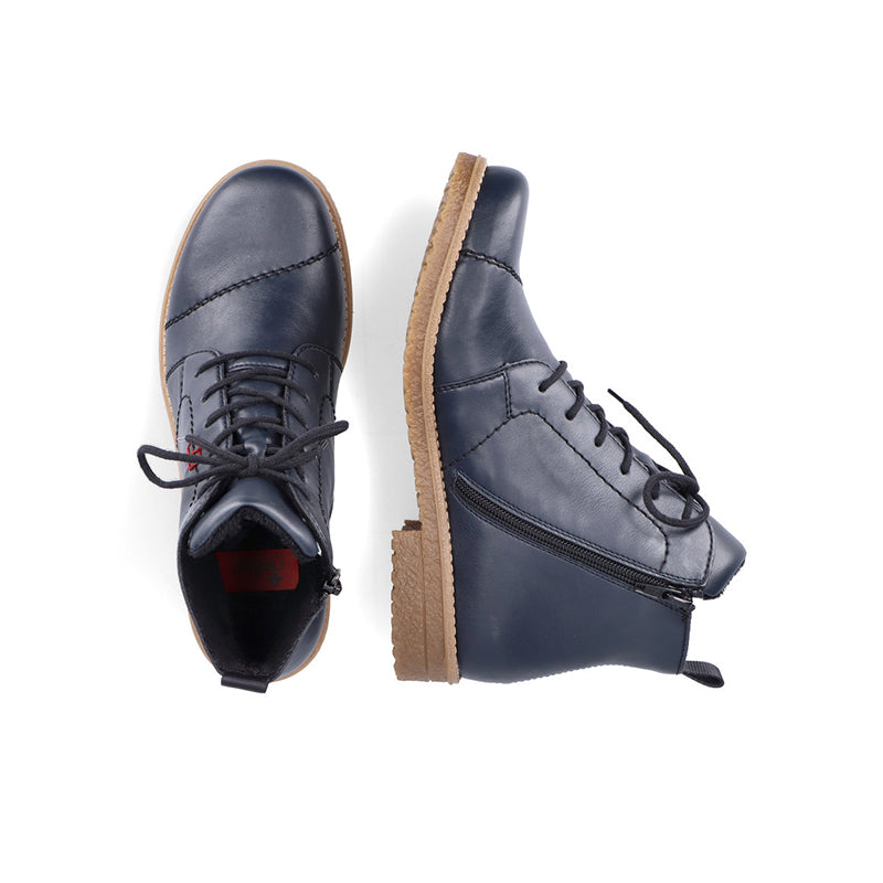 Navy-blue lace-up ankle boot pair with side zipper and tan tread sole
