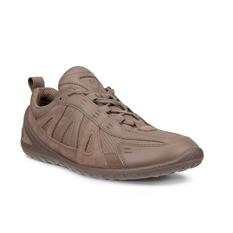 Brown women’s athletic sneaker with lace-up front and textured upper