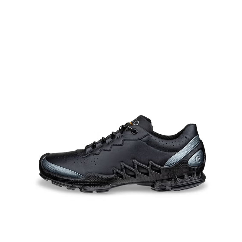 Black leather lace-up sneakers with logo detail and textured sole, angled view