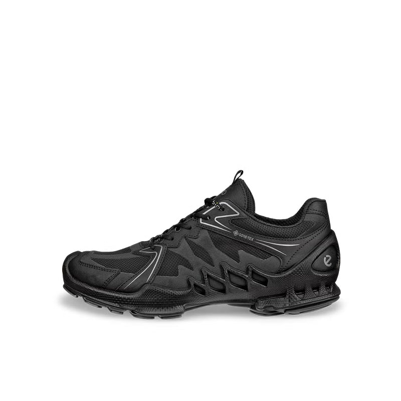 Black lace-up sneakers with textured upper and chunky treaded rubber outsole