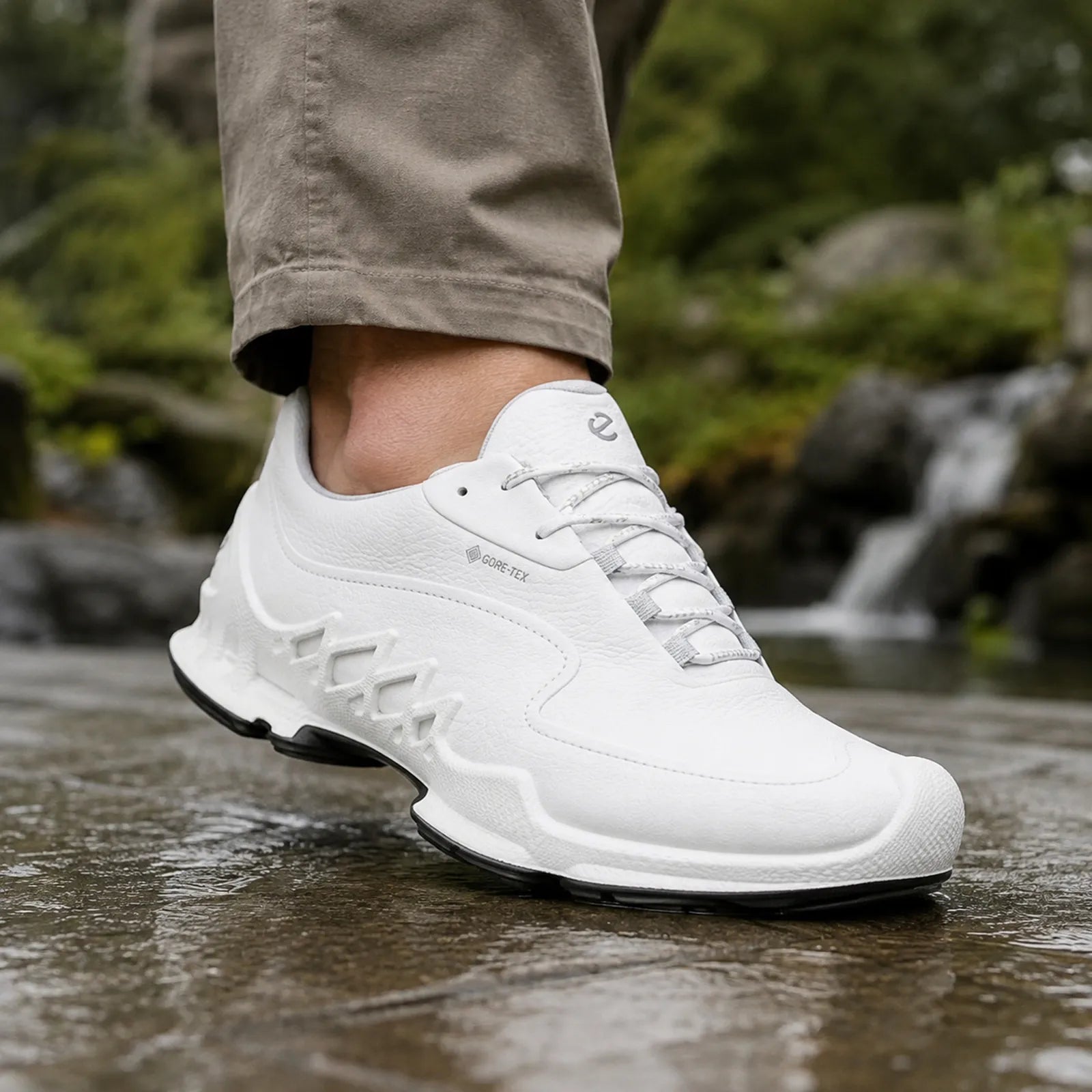 ECCO Biom AEX men's white sneaker on foot with rugged wet-traction tread