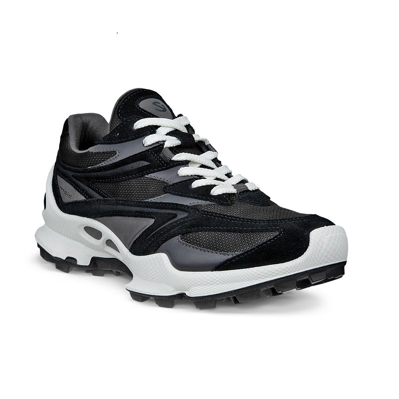 Black women’s trail sneakers with lace-up front, padded collar, and chunky white sole
