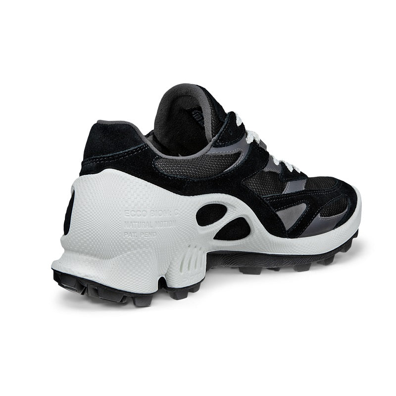 Black women’s trail sneakers heel and side view with lace-up design and treaded outsole